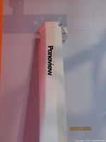 White metal casing of the pull down projection screen with Panoview logo