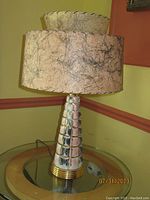 Full view of the lamp showing the tapered chrome and brass base with the textured marbled lampshade and the smaller secondary upper shade.