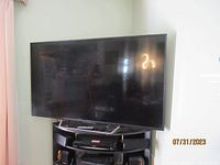 Front view of Sony flat-screen TV on stand