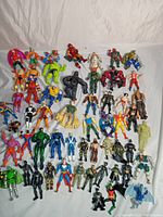 Overhead view of full set of ~45 figures on white backdrop
