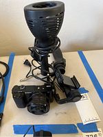 overview of camera, lens, light head and mount on table