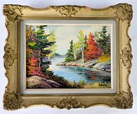 Full view of the framed oil painting showing a river landscape with colorful autumn trees and rocks. The frame is ornate wood with visible wear.