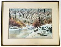 Full view of framed watercolour painting depicting winter creek landscape with bare trees and snow
