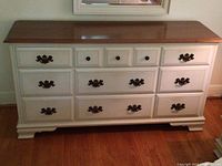 Front view of dresser showing all eleven drawers and overall condition