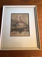 Photo of the framed art print showing the full frame and matting, with the artwork centered inside.