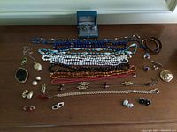 Overview of assorted jewelry on wooden surface