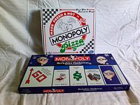 Photo of Monopoly Berkshire Hathaway Diamond Edition box in navy blue with Warren Buffett cartoon and Monopoly branding.