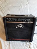 Front view of Peavey Rage 158 amplifier showing entire front grille and controls.
