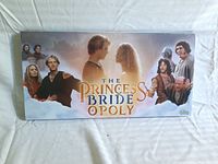 Front of The Princess Bride Monopoly board game box featuring characters from the movie and logo.