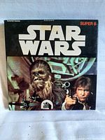 Front view of original Star Wars Super 8 film box featuring Chewbacca and Han Solo, with Star Wars logo and FOX branding.
