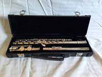 Vintage Vitas FL 200 flute inside a black lined case, showing 3 pieces of the flute and the case handle requiring repair.