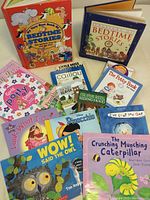 Overview of all children's books in the lot, showing a colorful assortment including bedtime stories and potty training guides.