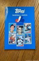 Front cover of the book showing the Topps logo, Montreal Expos logo, and six vintage baseball cards featuring Expos players.