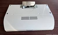 Front and top view of white Elica range hood vent showing vent outlet and overall shape