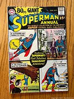 Front cover of Superman Annual #1 showing Superman in colorful comic style with various imaginative story panels and a price of 25 cents.