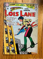 Front cover of Superman's Girlfriend Lois Lane comic issue #66 showing Lois Lane and Superman with a ladder and the title text.