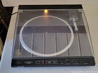 Front view of Sony PS-X555ES turntable with dust cover closed