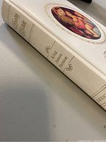 White hardcover Bible showing spine with gold embossed text 'Holy Bible', 'King James Version', and 'Lexicon'.