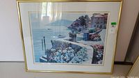 Photo showing framed serigraph artwork from a straight-on angle with visible details of the artwork and frame.