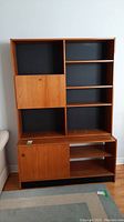 Front view of assembled two-piece cabinet showing overall design and condition