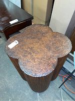 Front and top view of the artistic table showing the penny coin surface and wood dowel base