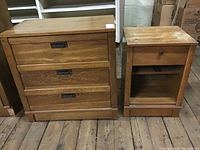 Dresser and nightstand side by side on wooden floor showing overall design and finish