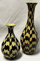 Two ceramic vases together showing size difference and pattern
