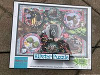 Image of sealed jigsaw puzzle box with colorful hipster-themed artwork including vintage camera and various hipster icons.