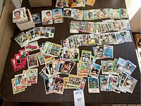 Overhead view of assorted trading cards spread across a table