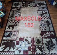 Full top-down image of rectangular wildlife-themed area rug with various animal and nature motifs around border and beige center.