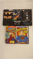 Five superhero movie covers: three Batman VHS, one Spider-Man VHS, one Superman DVD
