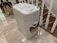 White Royal crosscut paper shredder with clear front inspection window, visible stickers and buttons on top.