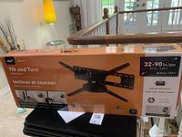 Boxed AVF Tilt and Turn TV Wall Mount showing front side with product image and size compatibility (32 to 90 inches)