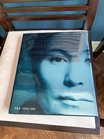 Photo showing the front cover of the Yoko Ono book titled 'Yes' with a blue artistic portrait of Yoko Ono's face.