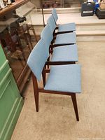 Side profile view of four chairs in a row