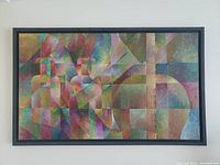 Full front view of the signed abstract oil painting showing geometric abstract shapes and muted pastel colors in a rectangular black frame.