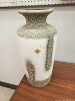 Tall textured ceramic vase with white and green glaze with Scheurich Keramik label