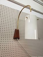 Full front view of lamp mounted on pegboard
