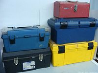 Front view of all five tool boxes showing variety of colors and sizes