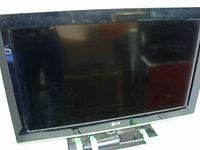 Front view of LG 32 inch television showing black bezel and LG logo with stand.