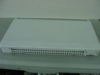 Front view of white rectangular wall mounted heater with vent grills.