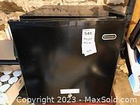 Closed mini freezer with black exterior and Whynter badge