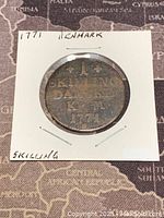 Photo of the obverse side showing denomination, country, and year 1771