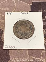 Obverse side of the copper coin showing East India Company crest and date 1835.