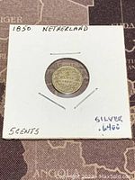 Photo of the coin's denomination side showing '5 CENTS' and '1850' with noted silver content of 0.640.