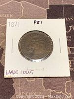 Reverse side of the 1871 Prince Edward Island large 1 cent copper coin showing island emblem and denomination.
