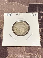 Obverse side of 1915 Buffalo Nickel featuring Native American profile, showing coin condition.