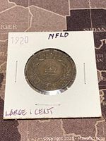 Front side of 1920 Newfoundland copper 1 cent coin showing the date, crown, denomination, and wreath design.