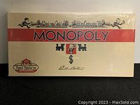 Photo of the game box front showing vintage Monopoly logo and artwork, sealed in original wrapping