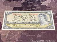 Front of 1954 Canada 20 dollar banknote showing portrait of Queen Elizabeth II, denomination, serial number, and bilingual text.